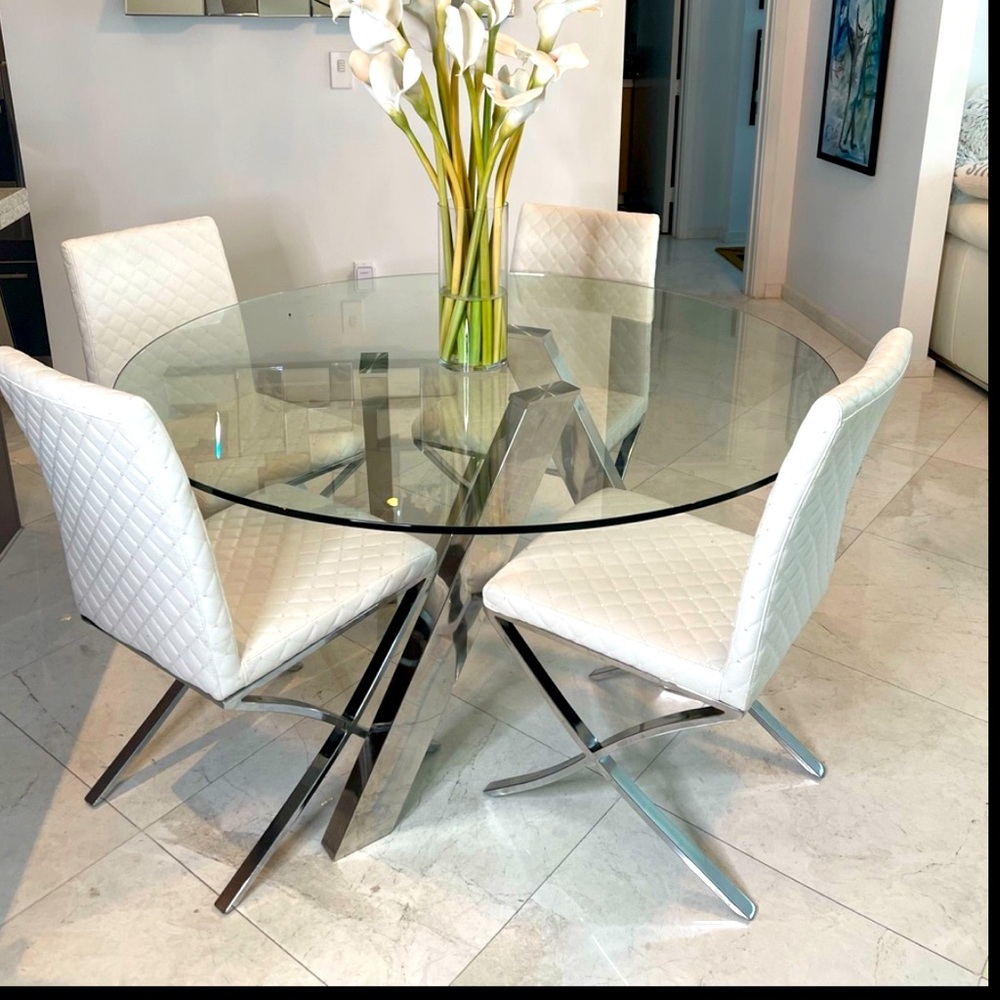 Glass table and chairs set . Kitchen table and 4 chairs included!